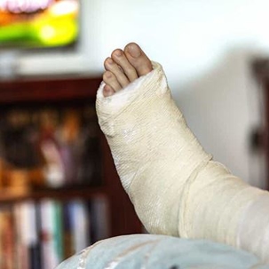 Man has a cast on his foot and ankle after suffering an orthopedic injury